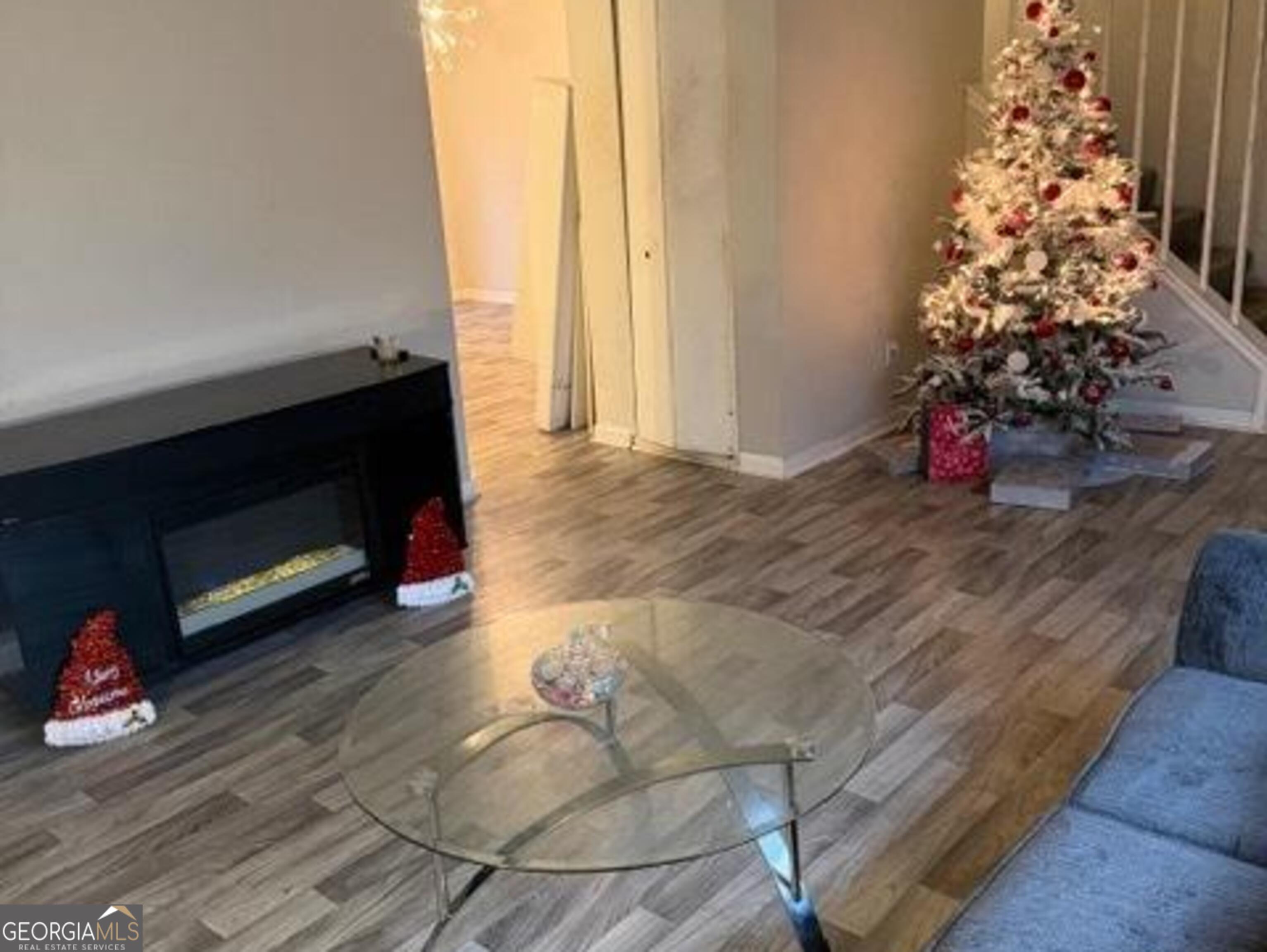 501 Carlton Road, Unit 3B Palmetto, GA 30268 - Photo 6 of 25 a living room with furniture and a fireplace