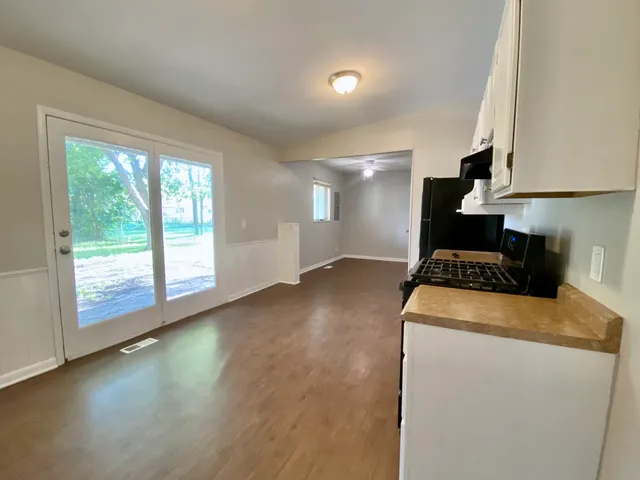 a kitchen with a stove and a refrigerator