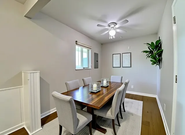a dining room with furniture and window