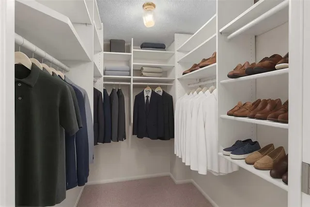 a bedroom with a bed potted plant and a window