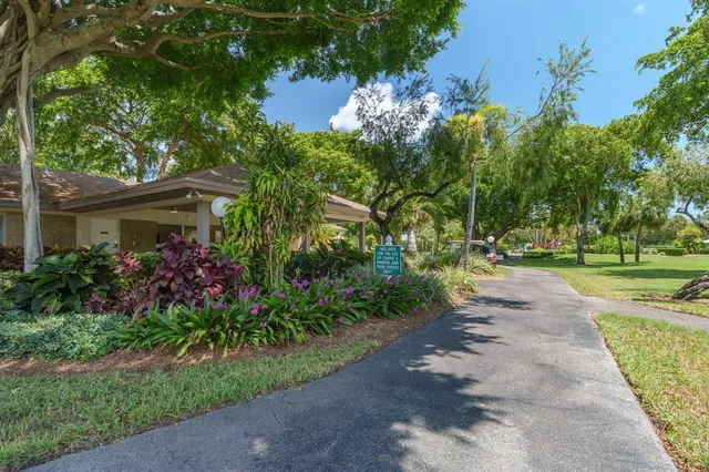 a picture of a bench in front of a gate