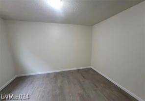 304 Orland Street, Unit 39 Las Vegas, NV 89107 - Photo 11 of 15 Unfurnished room with dark wood-type flooring and