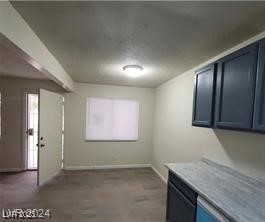304 Orland Street, Unit 39 Las Vegas, NV 89107 - Photo 13 of 15 Kitchen with blue cabinets, baseboards, and light