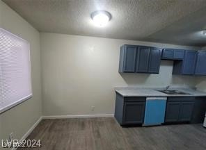 304 Orland Street, Unit 39 Las Vegas, NV 89107 - Photo 15 of 15 Kitchen featuring dark wood-style flooring, light