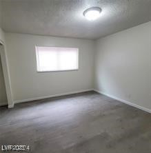 304 Orland Street, Unit 39 Las Vegas, NV 89107 - Photo 3 of 15 Empty room with baseboards and concrete flooring
