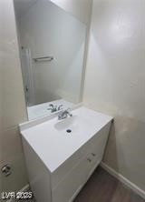 304 Orland Street, Unit 39 Las Vegas, NV 89107 - Photo 9 of 15 Bathroom featuring wood finished floors and vanity