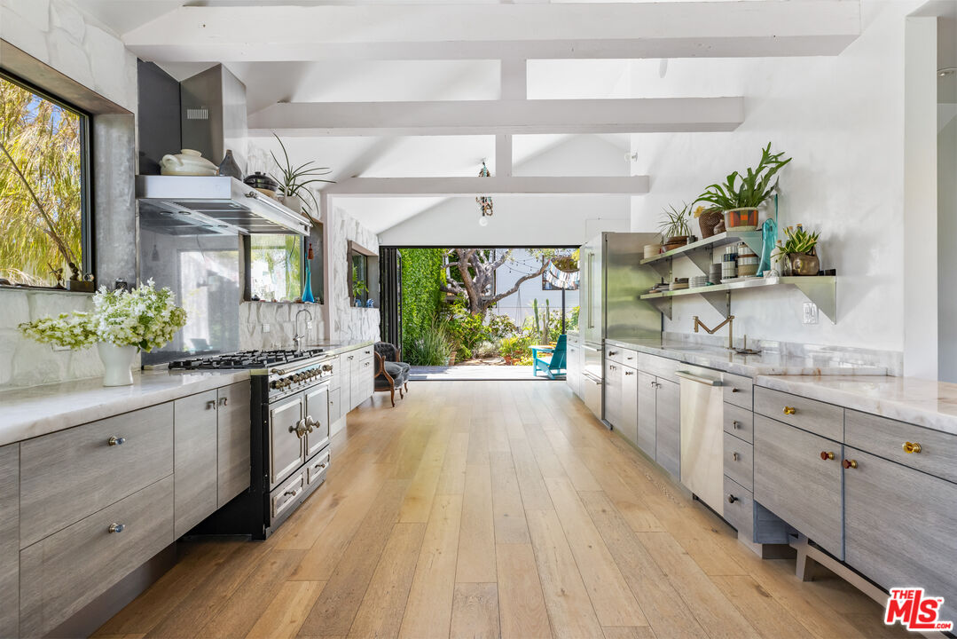 817 Palms Boulevard Venice, CA 90291 - Photo 11 of 31 a large kitchen with stainless steel appliances a large window in it
