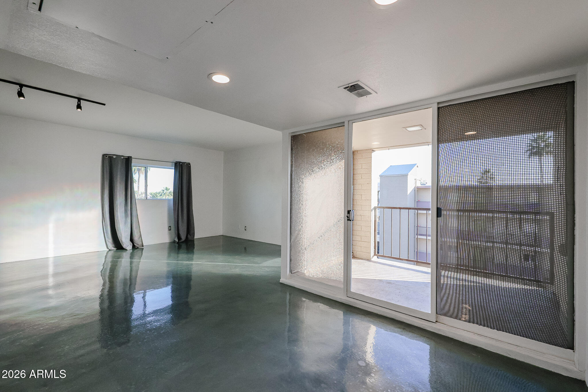 353 East Thomas Road, Unit C501 Phoenix, AZ 85004 - Photo 19 of 53 a view of empty room with wooden floor and fan