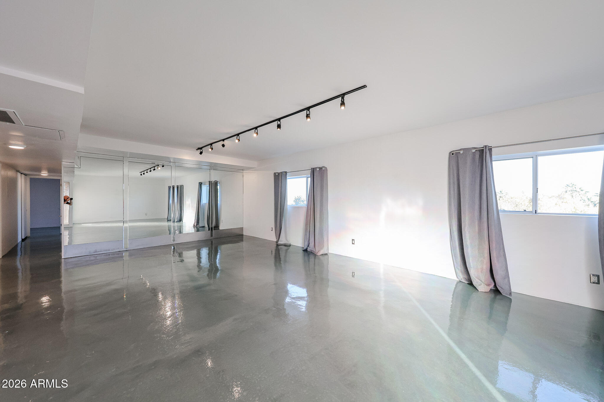 353 East Thomas Road, Unit C501 Phoenix, AZ 85004 - Photo 3 of 53 a view of empty room with wooden floor and fan