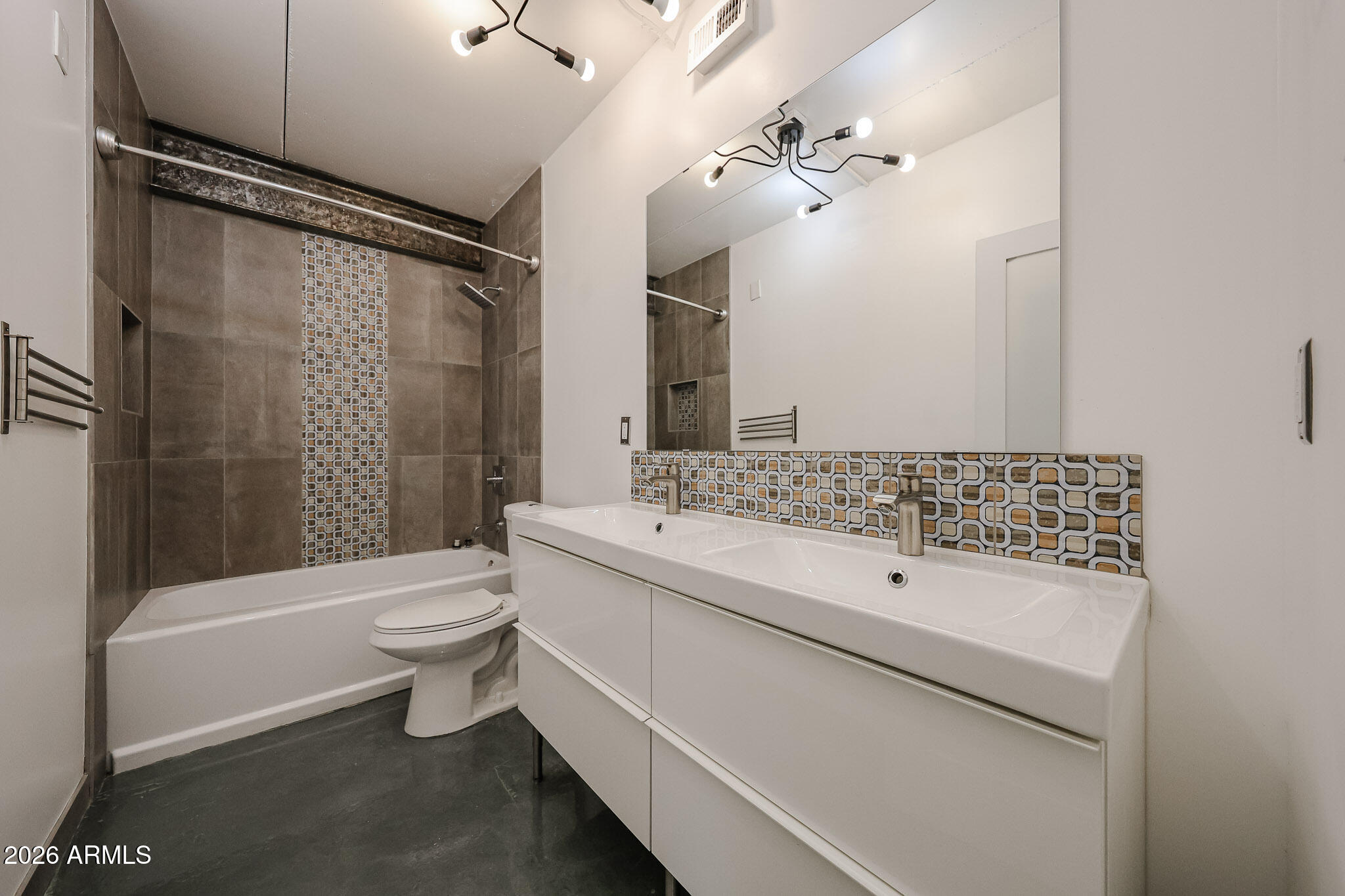 353 East Thomas Road, Unit C501 Phoenix, AZ 85004 - Photo 32 of 53 a bathroom with a sink a toilet and shower