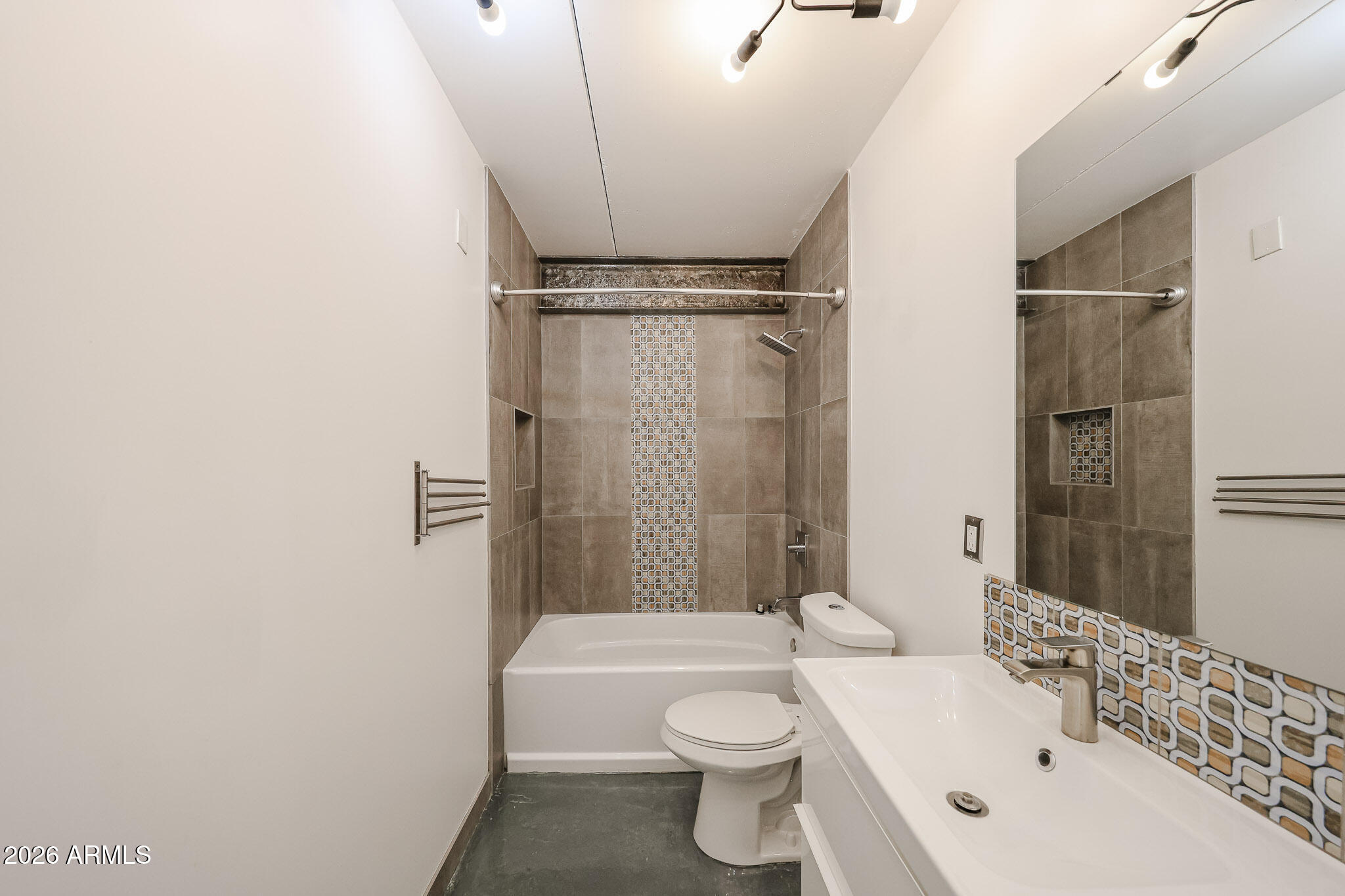 353 East Thomas Road, Unit C501 Phoenix, AZ 85004 - Photo 33 of 53 a bathroom with a toilet a sink and bathtub