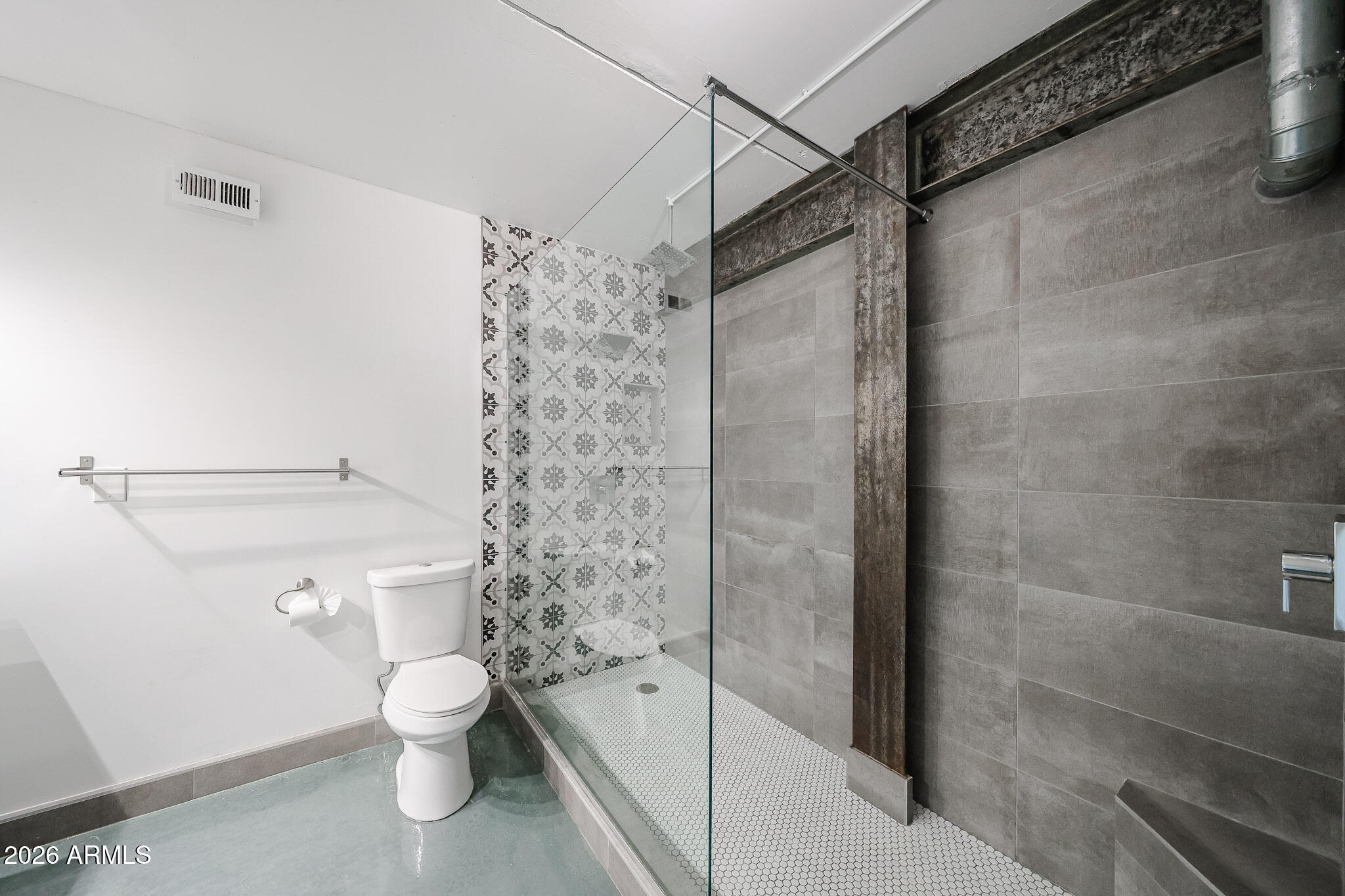 353 East Thomas Road, Unit C501 Phoenix, AZ 85004 - Photo 48 of 53 a white toilet sitting next to a bathroom sink