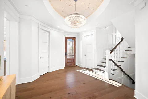 a dining table with chairs and wooden floor