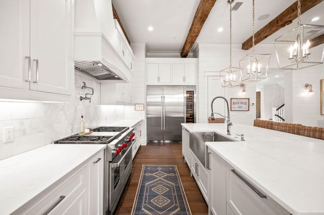 a view of a dining room with furniture large windows and wooden floor