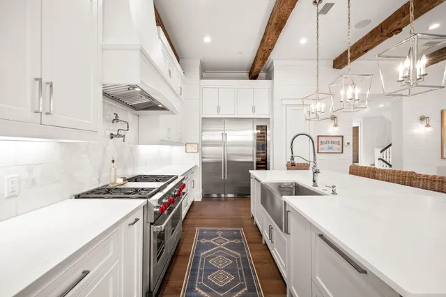 a view of a dining room with furniture large windows and wooden floor
