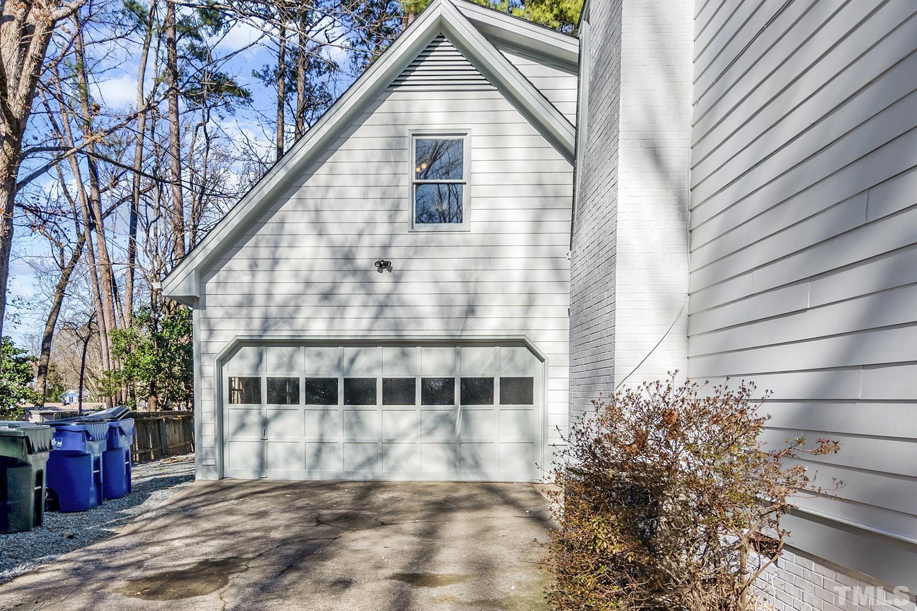 305 Windel Drive Raleigh, NC 27609 - Photo 3 of 39 a front view of a house with a garden