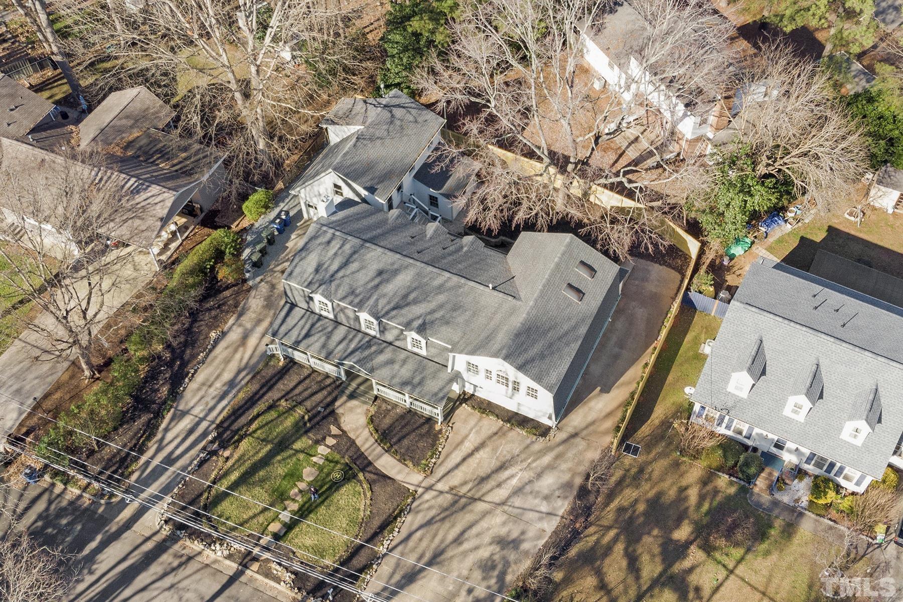 305 Windel Drive Raleigh, NC 27609 - Photo 9 of 39 view of a house with a yard