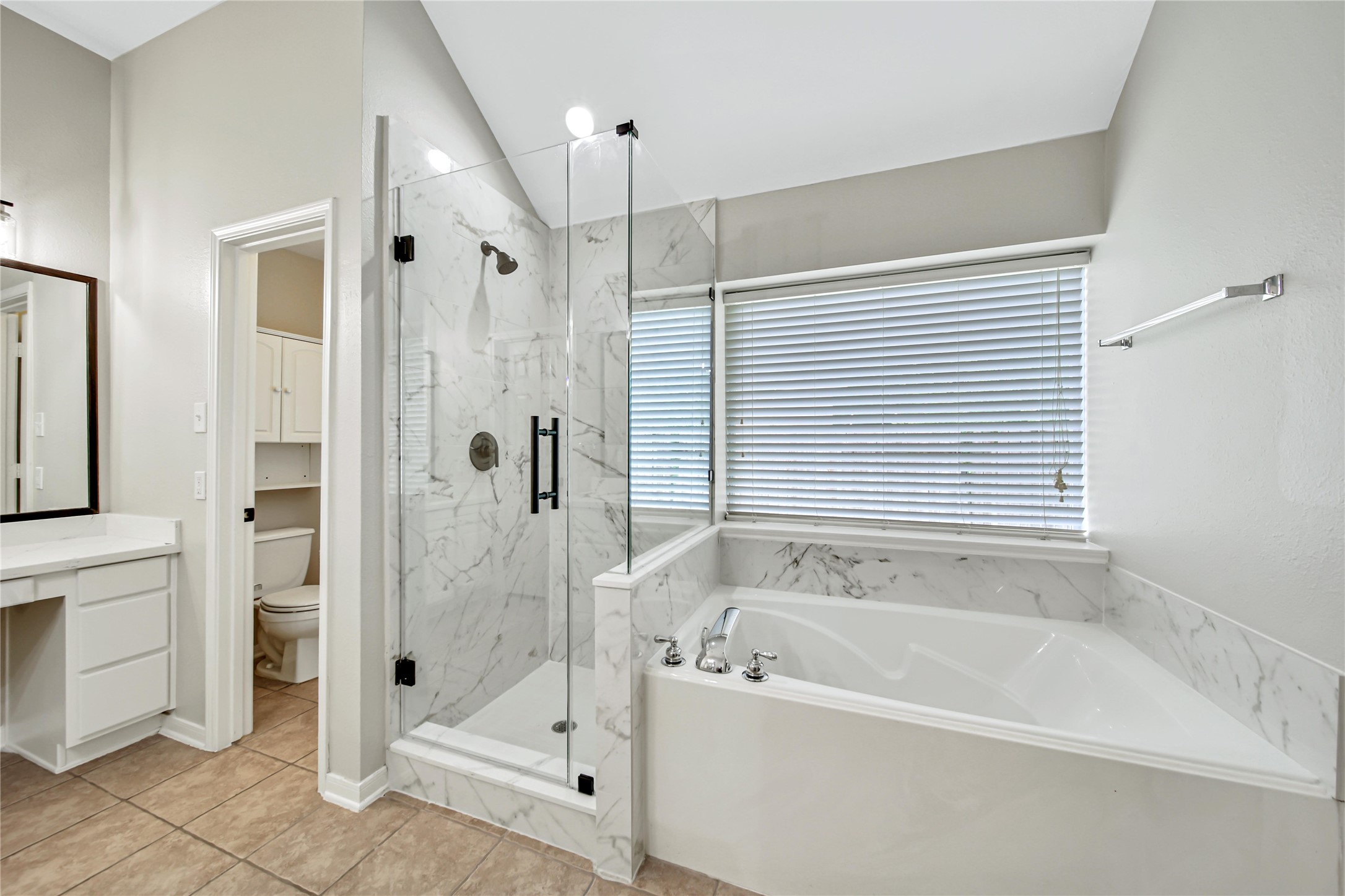 14526 Red Tailed Hawk Lane Houston, TX 77044 - Photo 23 of 40 a bathroom with a bathtub and a shower