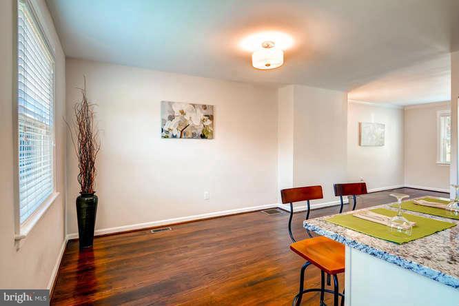 3821 Kimble Road Baltimore, MD 21218 - Photo 11 of 29 a living room with furniture and a wooden floor