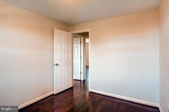 3821 Kimble Road Baltimore, MD 21218 - Photo 18 of 29 wooden floor in an empty room