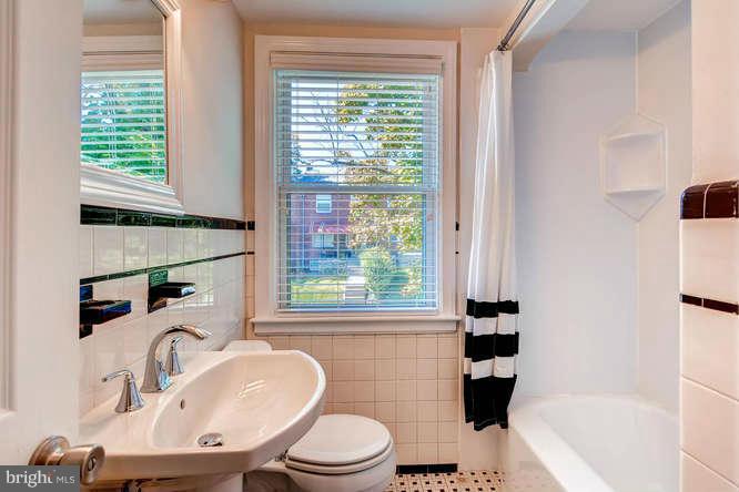3821 Kimble Road Baltimore, MD 21218 - Photo 23 of 29 a bathroom with a sink a toilet and a bathtub