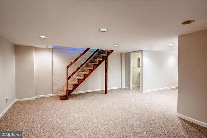 3821 Kimble Road Baltimore, MD 21218 - Photo 25 of 29 a view of an empty room with stairs