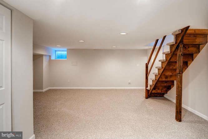 3821 Kimble Road Baltimore, MD 21218 - Photo 26 of 29 a view of an empty room with stairs