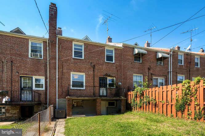 3821 Kimble Road Baltimore, MD 21218 - Photo 29 of 29 a front view of a house with a garden