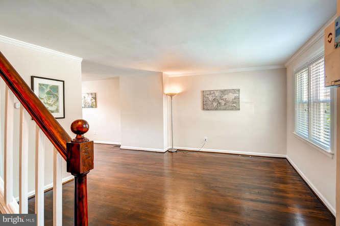 3821 Kimble Road Baltimore, MD 21218 - Photo 5 of 29 a view of an entryway with wooden floor and stairs