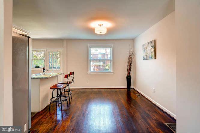 3821 Kimble Road Baltimore, MD 21218 - Photo 9 of 29 wooden floor in an empty room with a window