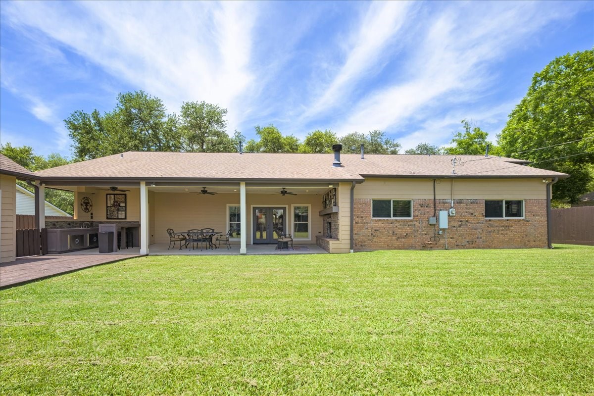 1502 Reimer Street Brenham, TX 77833 - Photo 28 of 30 a front view of a house with a garden and porch