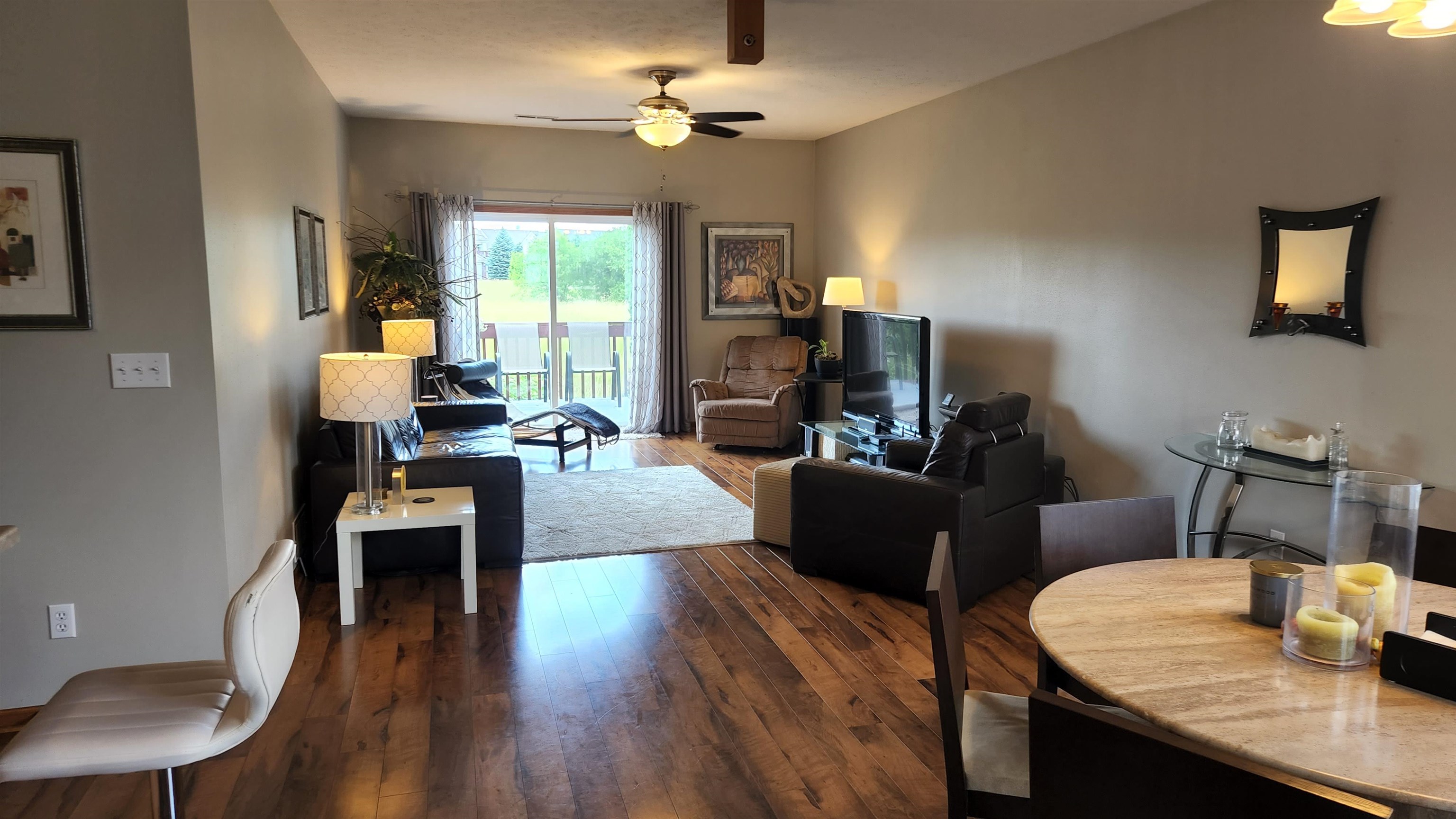 10326 Marblewing Road Roscoe, IL 61073 - Photo 4 of 12 a living room with furniture fireplace and a table