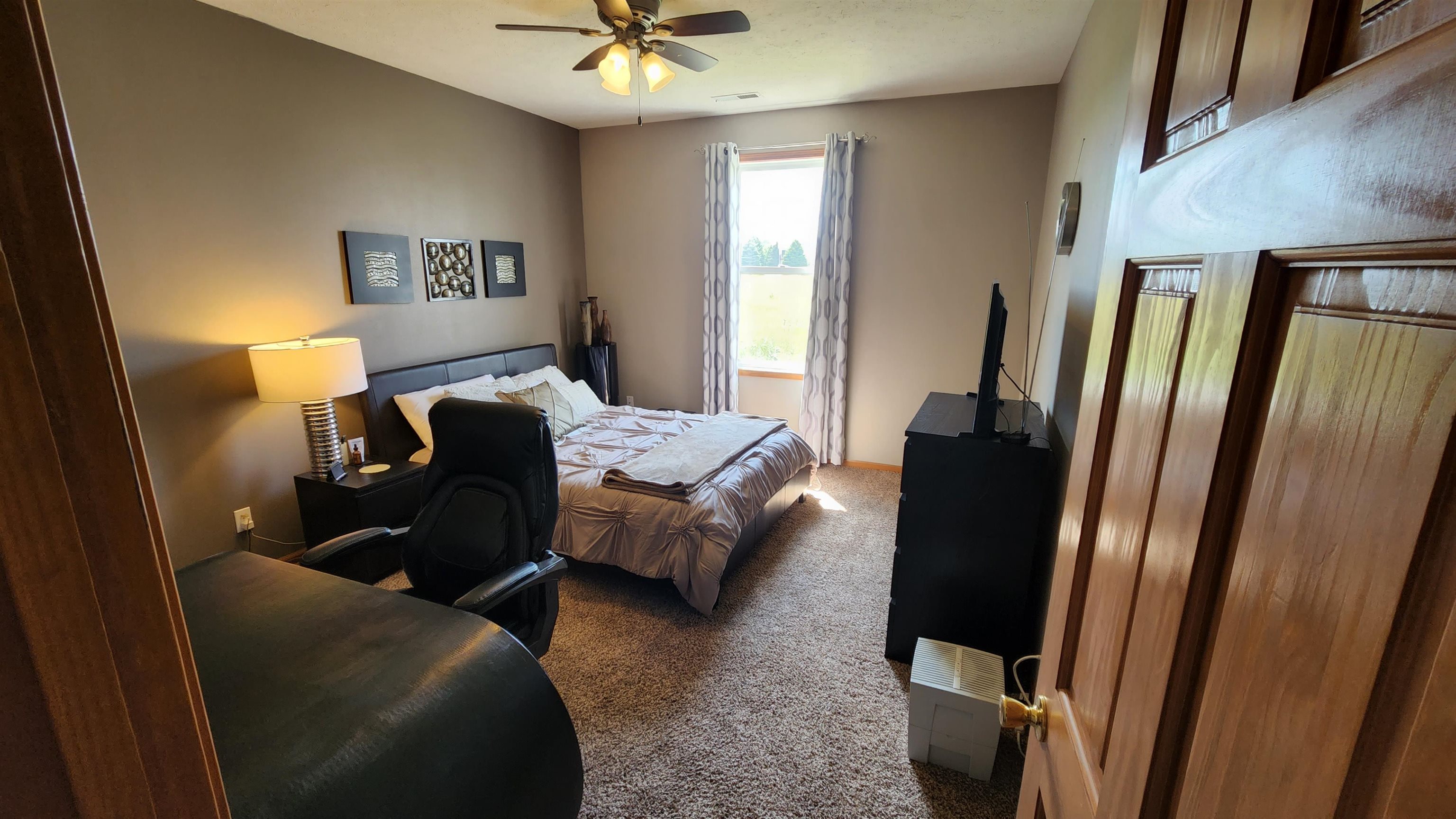 10326 Marblewing Road Roscoe, IL 61073 - Photo 6 of 12 a bed room with a bed and a mirror