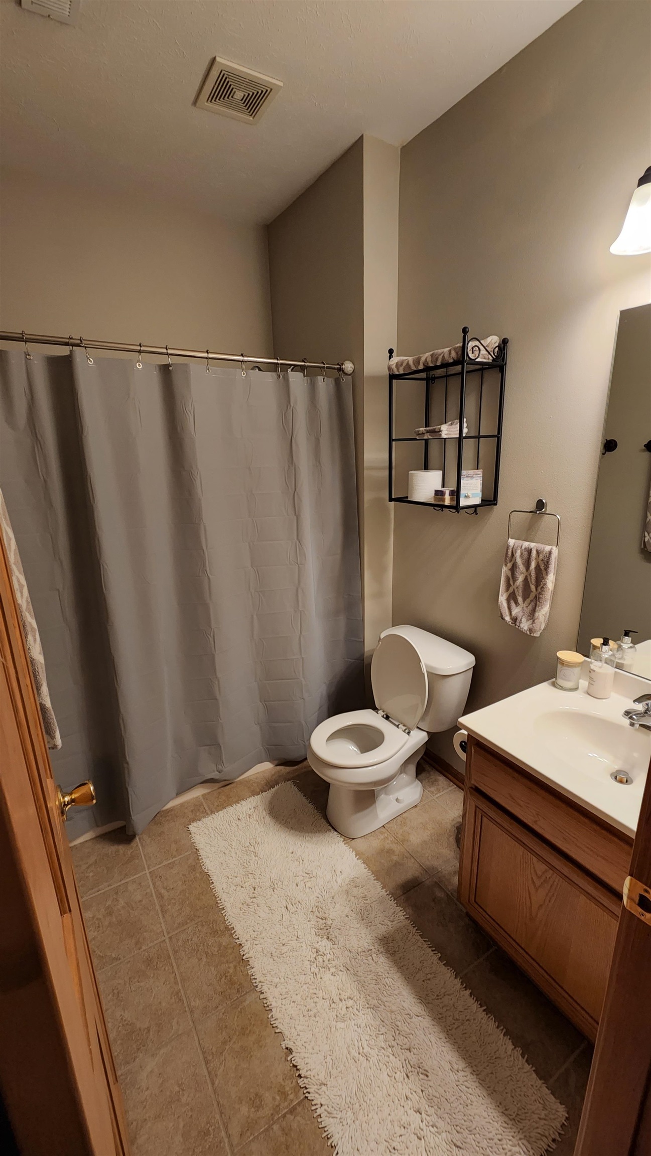 10326 Marblewing Road Roscoe, IL 61073 - Photo 10 of 12 a bathroom with a sink and a mirror