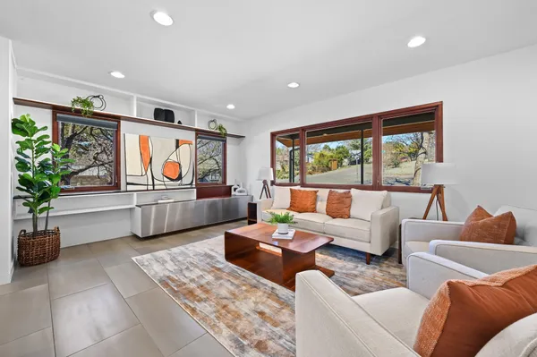 a living room with furniture and a large window