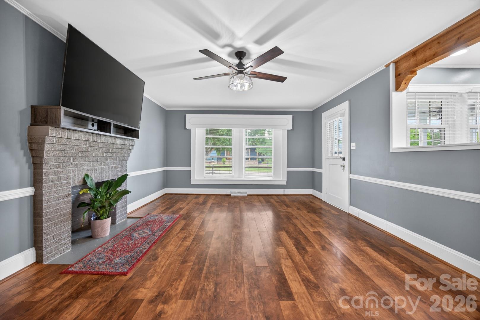 1016 Raney Street Salisbury, NC 28146 - Photo 7 of 45 a view of an empty room with wooden floor and a window