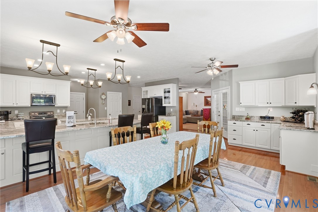 3600 Market Road Mechanicsville, VA 23111 - Photo 21 of 67 a view of a dining room with furniture and wooden floor