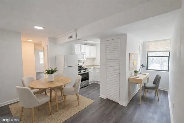 a view of a dining room with furniture and wooden floor