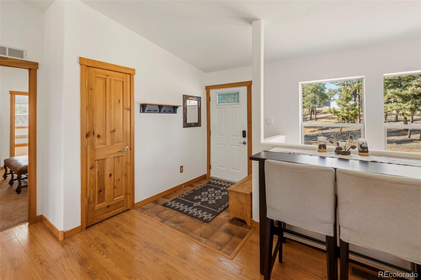 738 Rangeview Road Divide, CO 80814 - Photo 2 of 47 a living room with a stove and a window