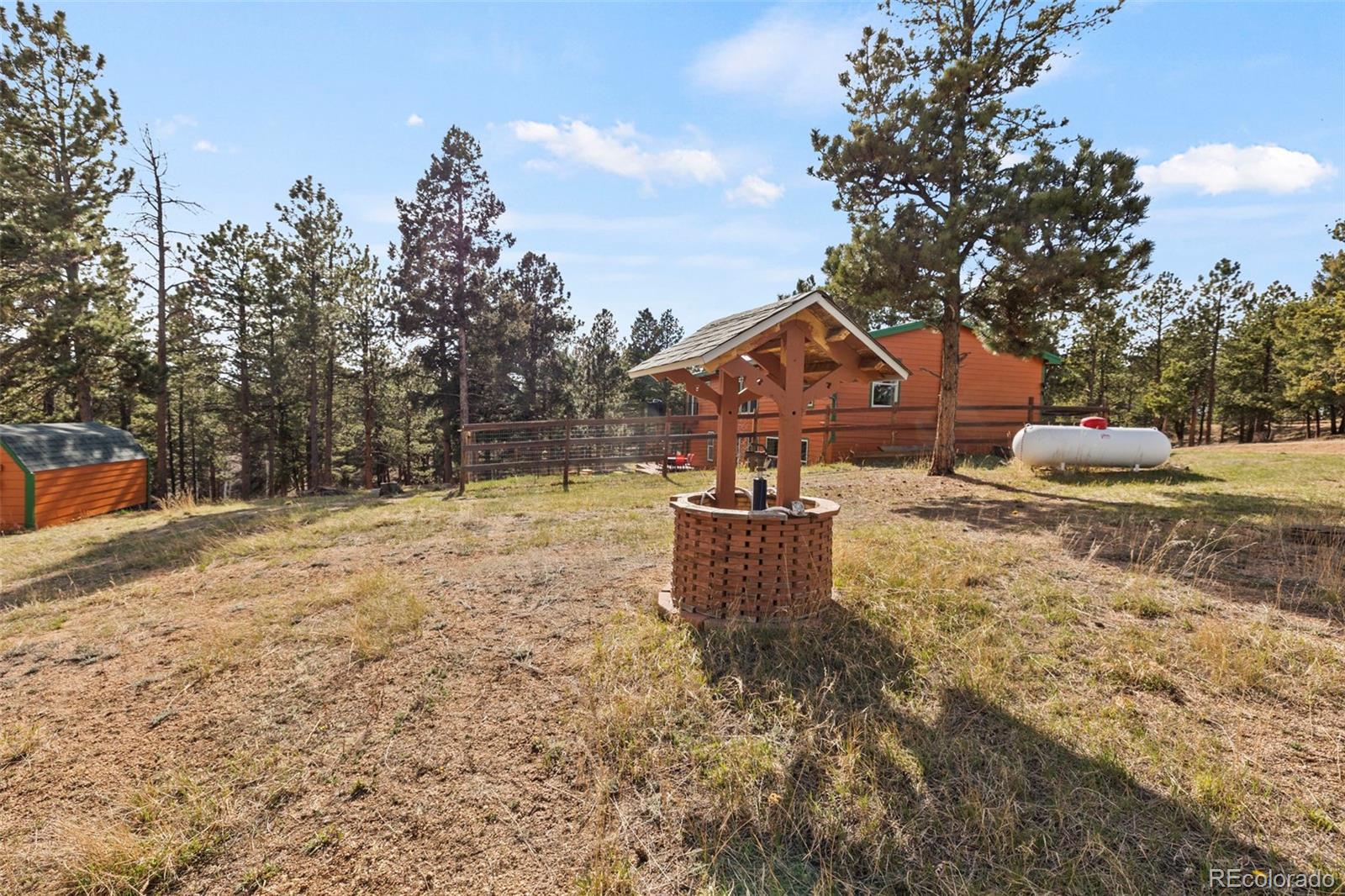 738 Rangeview Road Divide, CO 80814 - Photo 38 of 47 a front view of a house with yard and trees