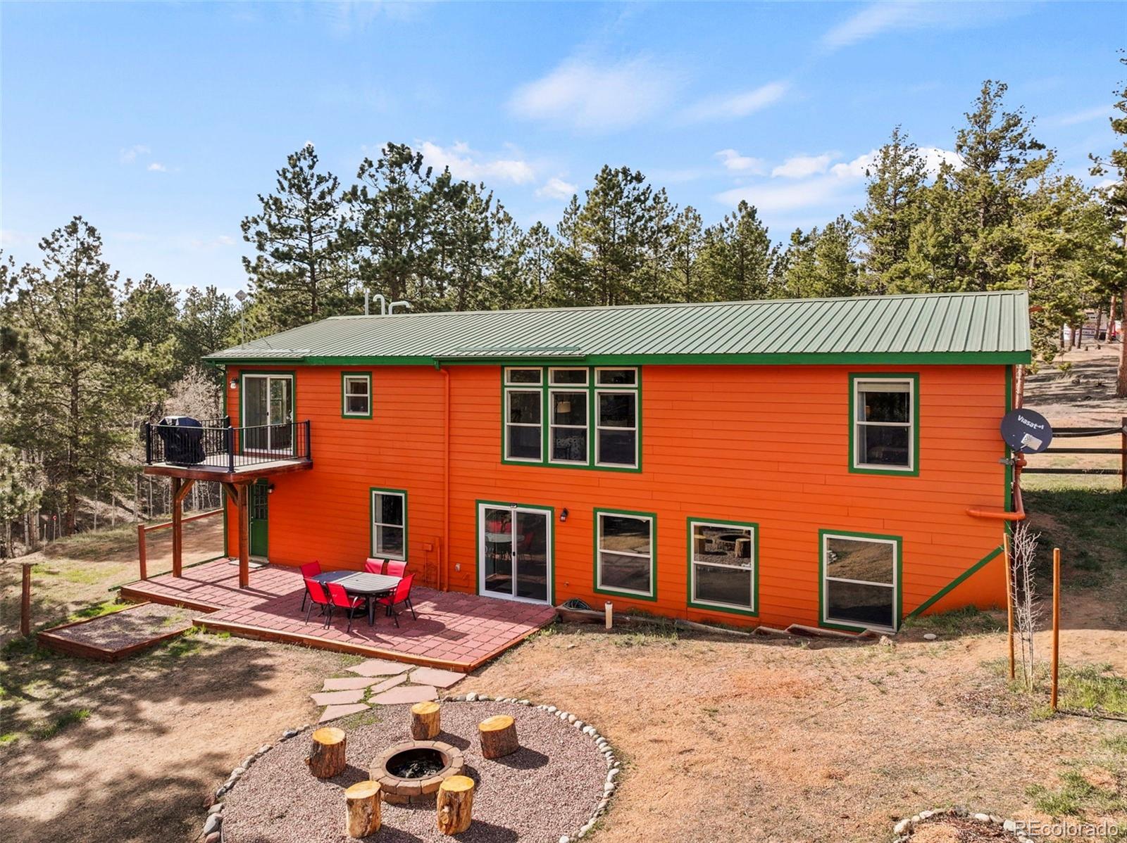 738 Rangeview Road Divide, CO 80814 - Photo 46 of 47 a front view of a house with garden