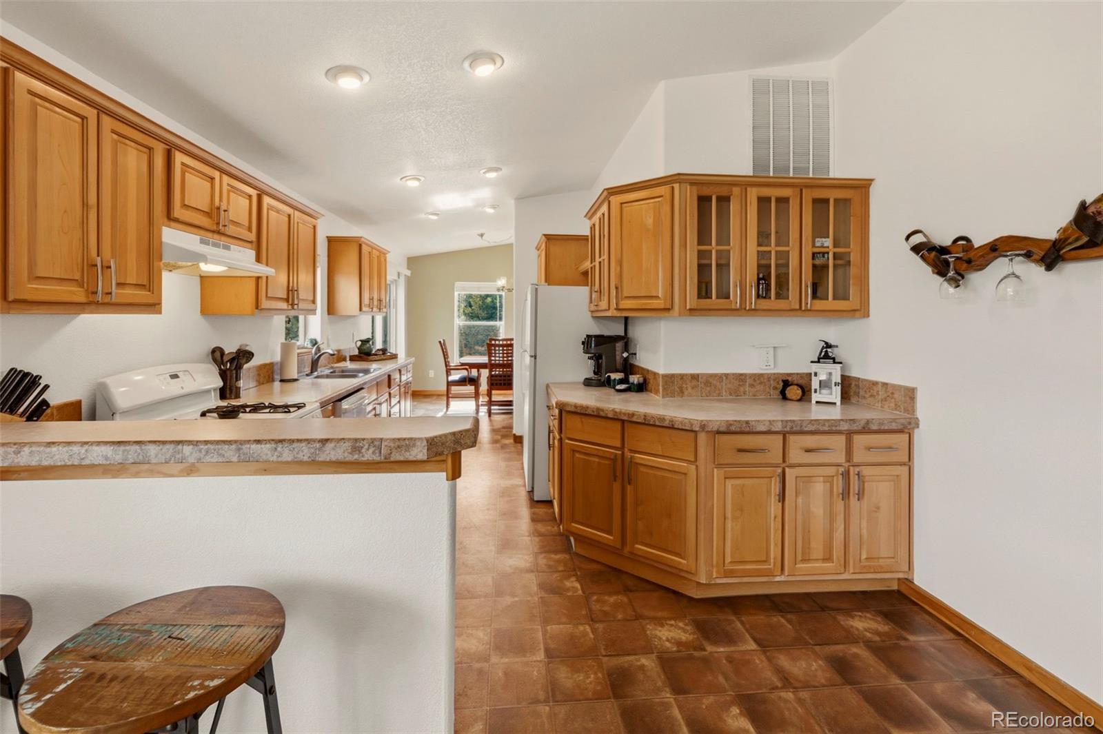 738 Rangeview Road Divide, CO 80814 - Photo 6 of 47 a kitchen with stainless steel appliances granite countertop a sink and cabinets