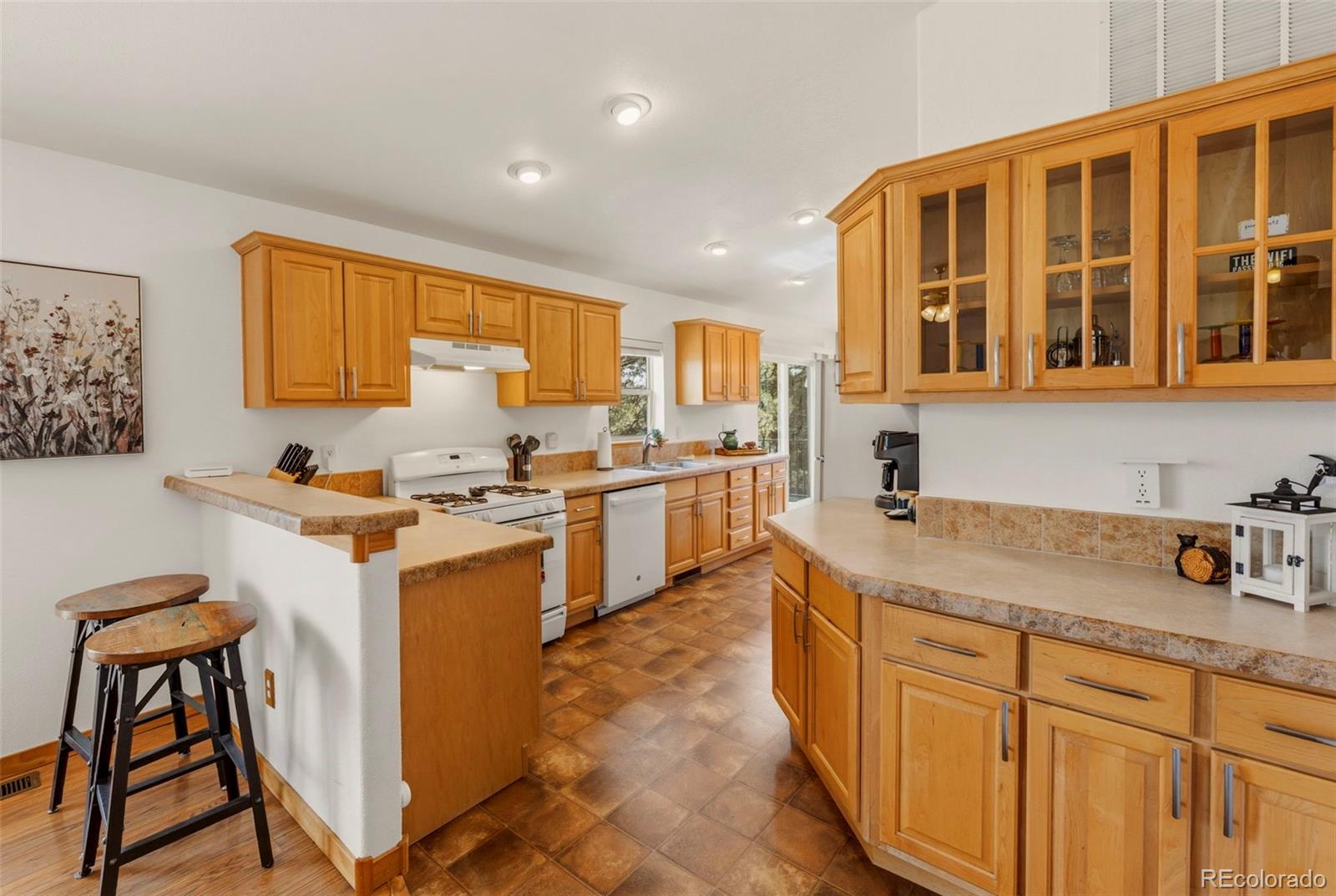 738 Rangeview Road Divide, CO 80814 - Photo 8 of 47 a kitchen with a sink stove and cabinets