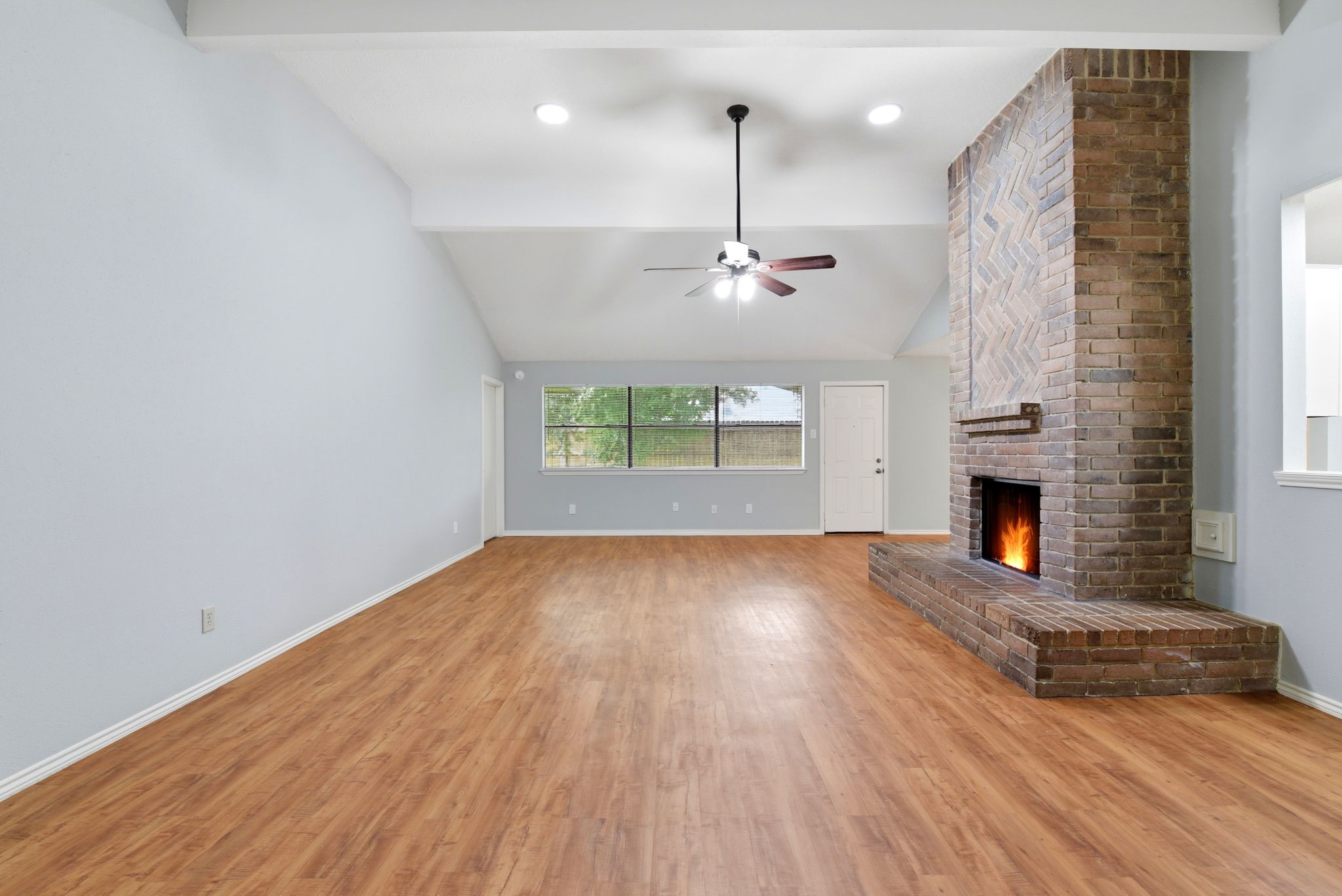 21330 Golden Dove Drive Spring, TX 77388 - Photo 5 of 29 Notice the gorgeous, wood-look laminate flooring that stretches across all the main living spaces—no carpet here!
