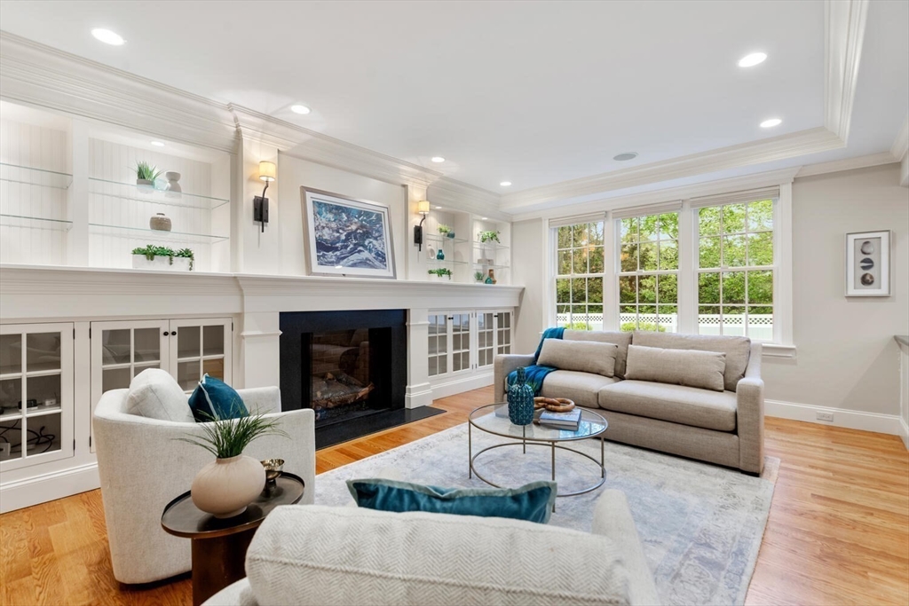 107 Kendall Road Lexington, MA 02421 - Photo 12 of 40 a living room with furniture and a fireplace