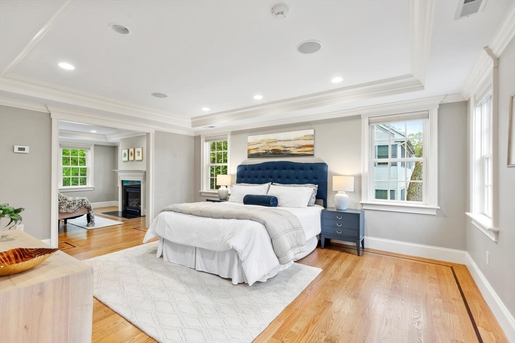 107 Kendall Road Lexington, MA 02421 - Photo 19 of 40 a spacious bedroom with a large bed and a couch