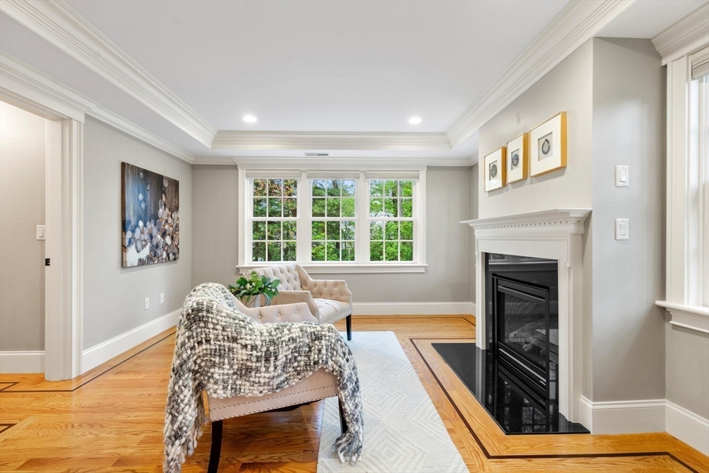 107 Kendall Road Lexington, MA 02421 - Photo 21 of 40 a living room with furniture and a fireplace