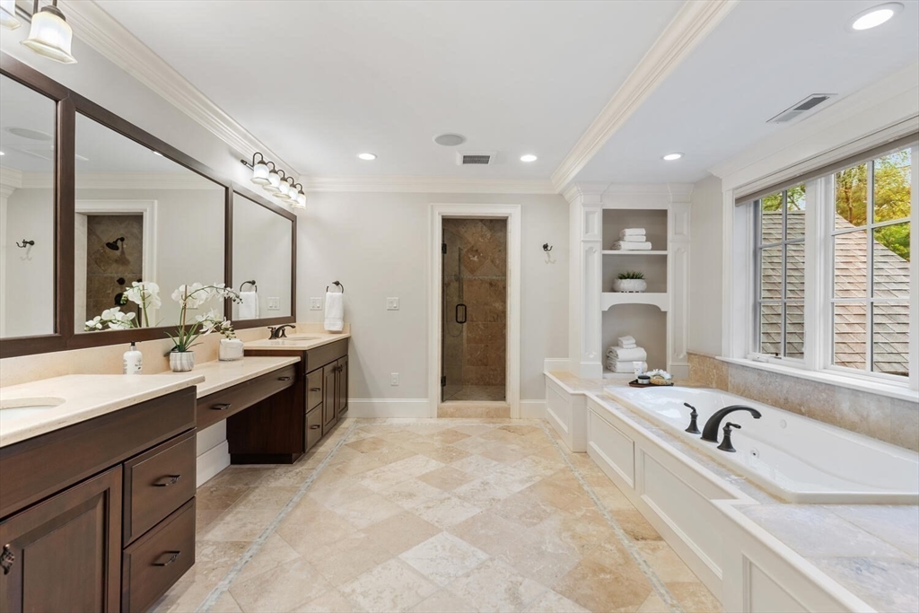 107 Kendall Road Lexington, MA 02421 - Photo 22 of 40 a large bathroom with a large tub sink and double vanity
