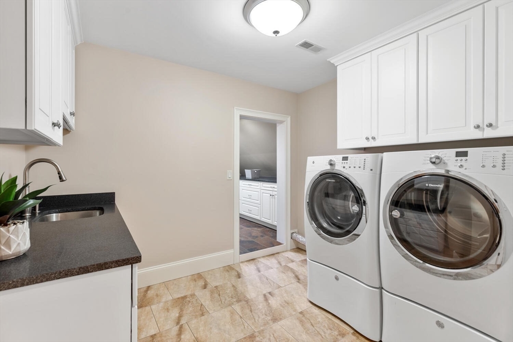 107 Kendall Road Lexington, MA 02421 - Photo 29 of 40 a utility room with sink dryer and washer