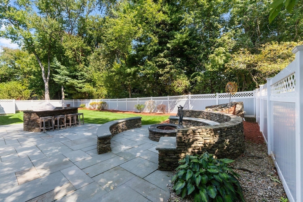 107 Kendall Road Lexington, MA 02421 - Photo 32 of 40 an outdoor sitting area with couch and a fire pit